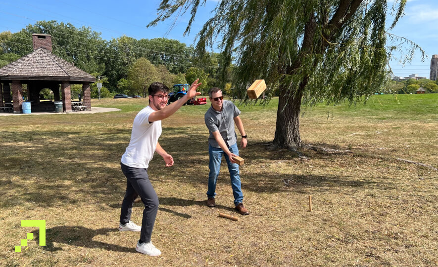 Creed team members playing Kubb at Boom Island Park