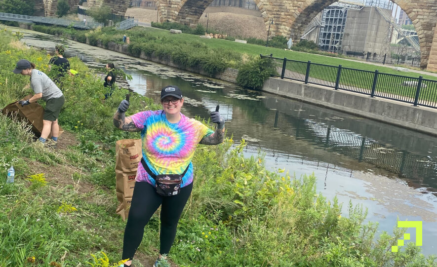 Creed team members cleaning up the banks of the Mississippi river